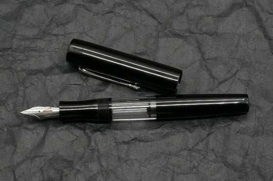 Orville - Medium - Black ebonite, clear acrylic - clip - piston - #6 nib
