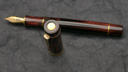 Orville - Medium - SEM Red ripple ebonite - brass trim - clip - #6 nib