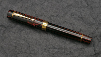 Orville - Medium - SEM Red ripple ebonite - brass trim - clip - #6 nib