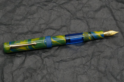 Orville - Medium - Tropical ebonite, blue acrylic, knurled ring - clip - piston - #6 nib