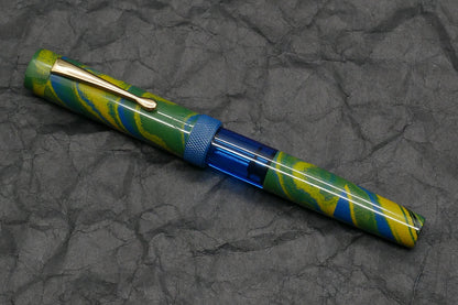 Orville - Medium - Tropical ebonite, blue acrylic, knurled ring - clip - piston - #6 nib